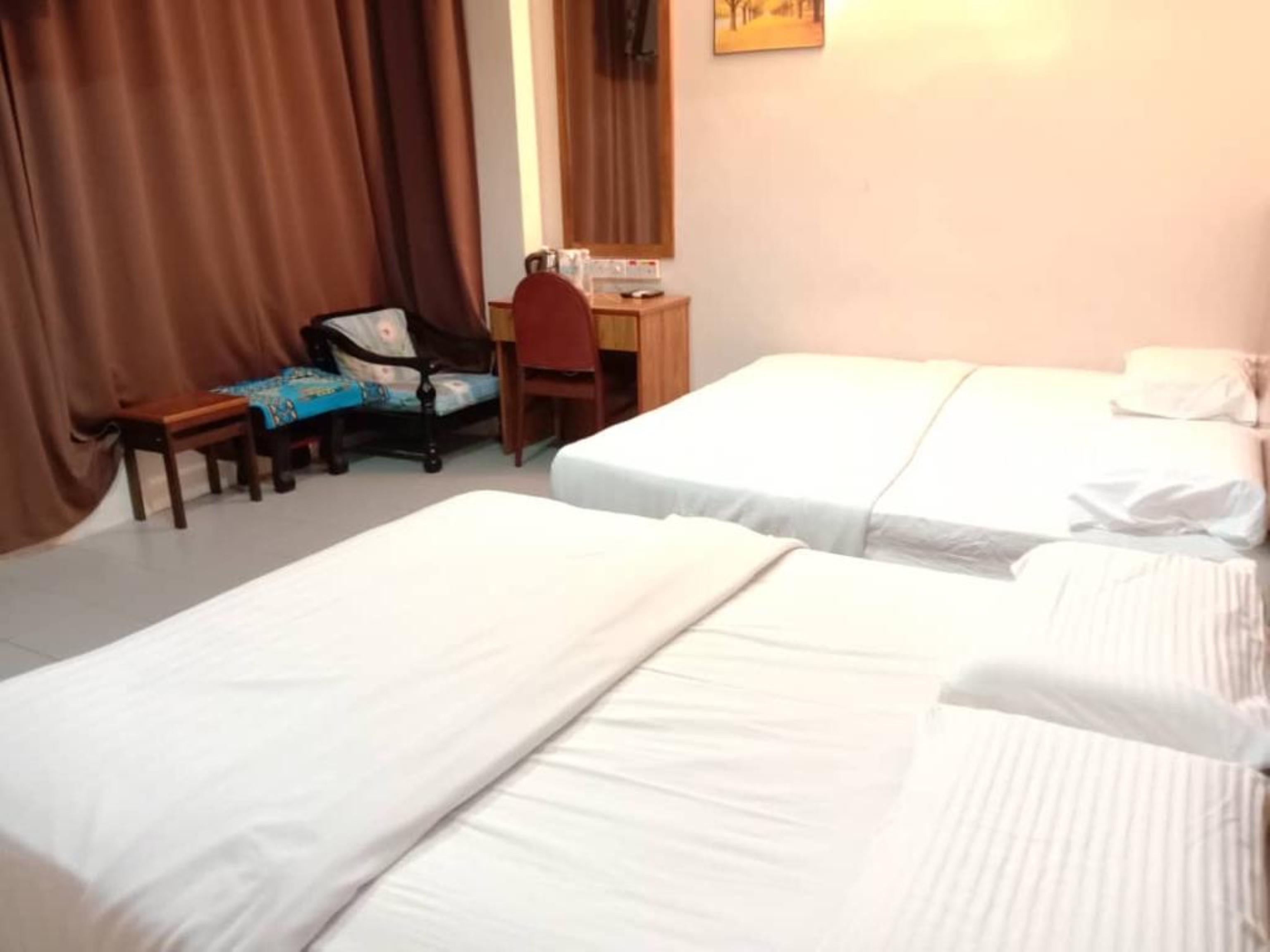 Oyo 89877 Sun Triang Hotel Kampong Kerayong Exterior photo